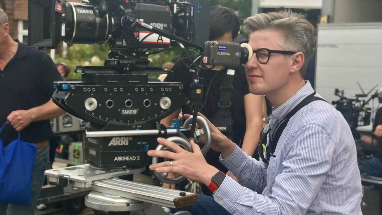 Ed moore shooting a camera