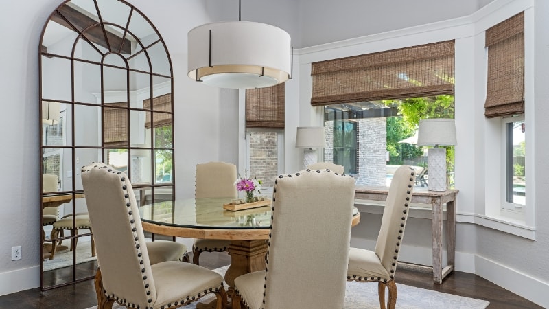 Circular dining table case with personal preference chandelier directly on top 
