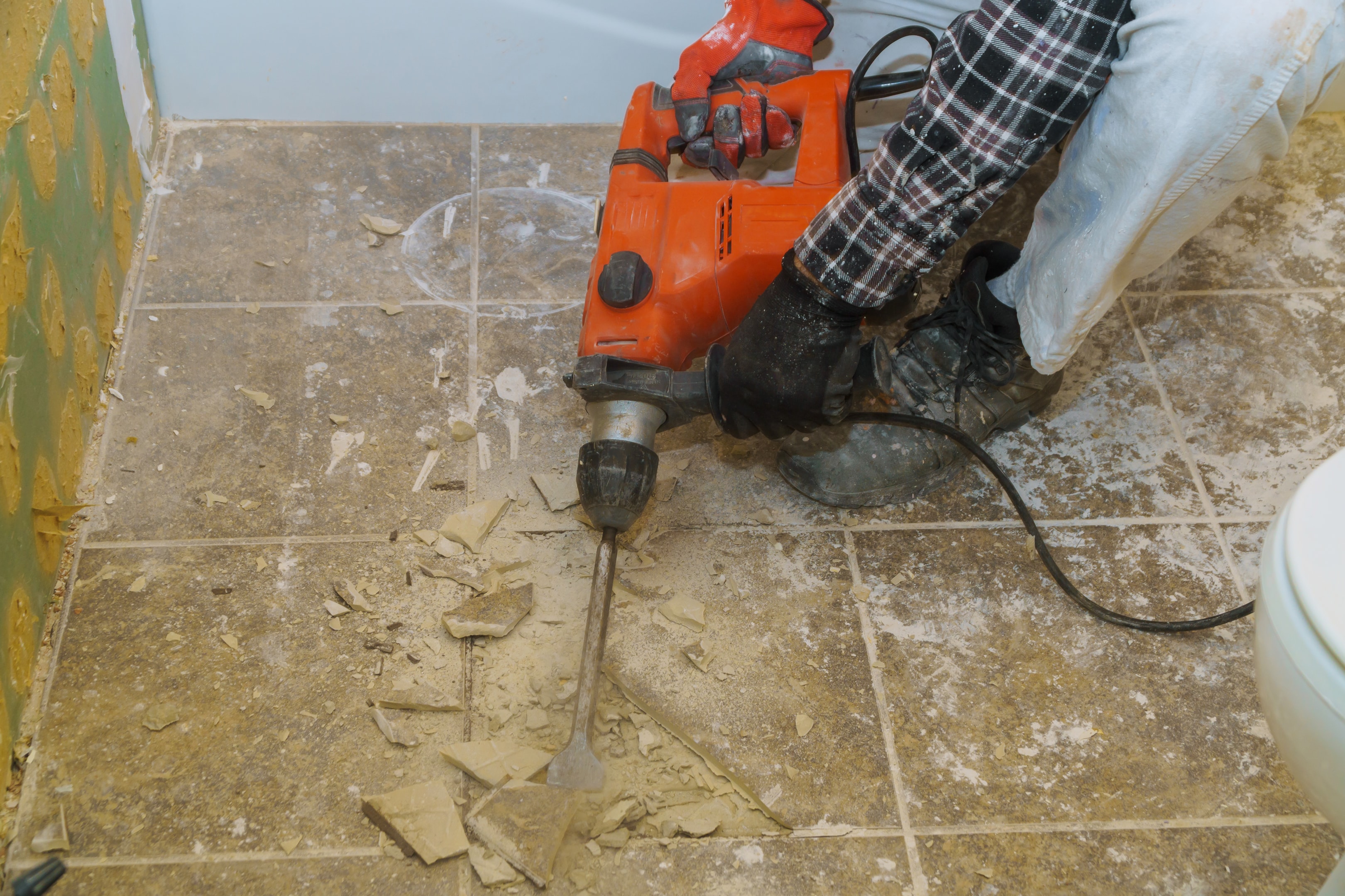 Breaking the concrete floor for a new bathroom leads to disruptive noise and heavy dust in your home