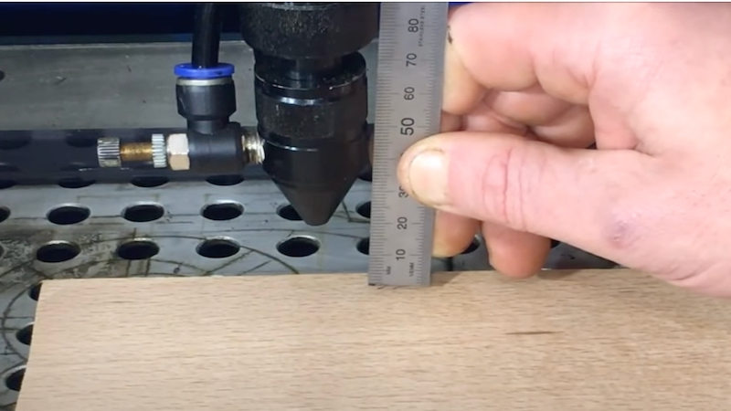 Measure the distance between the sensor and the focal point with a ruler.