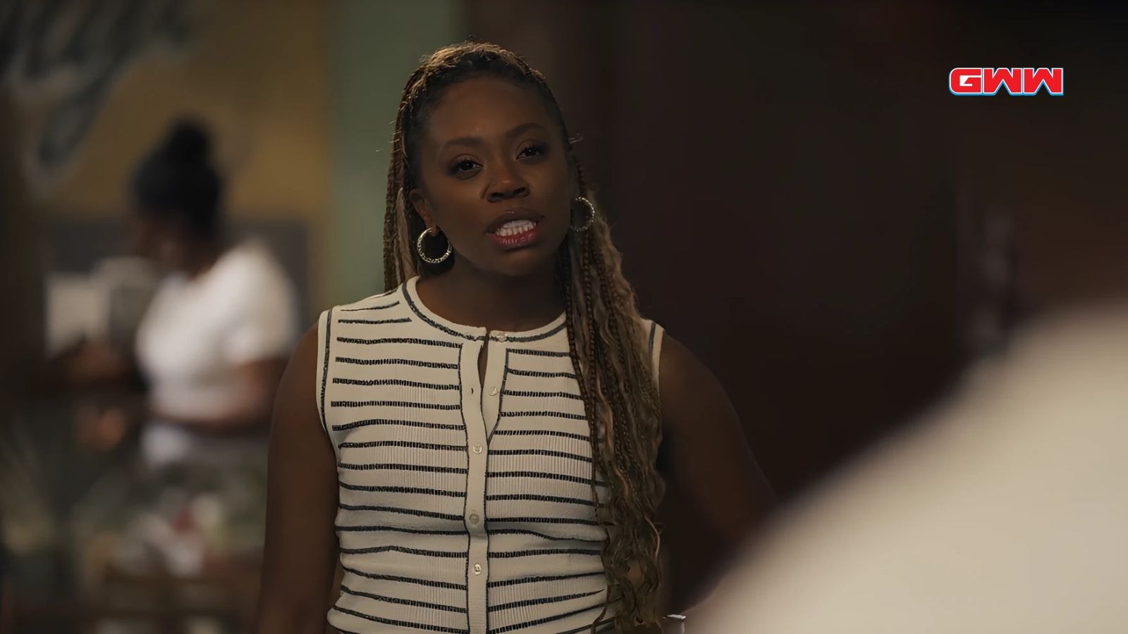 Cassandra Freeman as Vivian Banks speaking in striped top serious expression