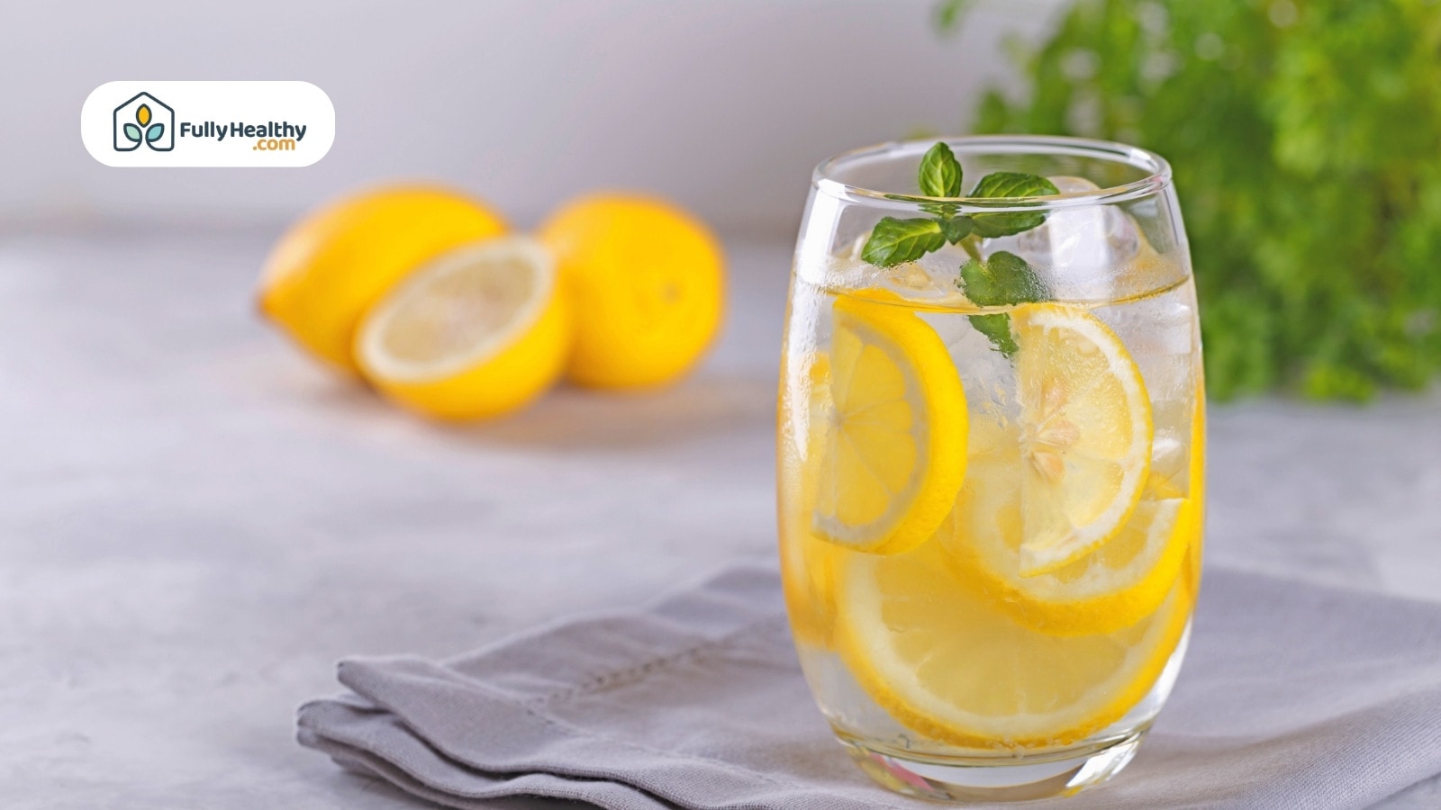 Refreshing lemon water with mint served in a clear glass