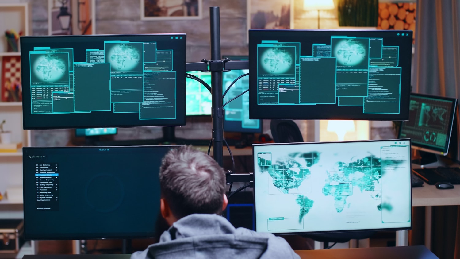 A security analyst is seated in front of multiple screens filled with data, maps, and real-time security feeds. The setup represents a cloud surveillance system used for monitoring threats and maintaining workplace security.