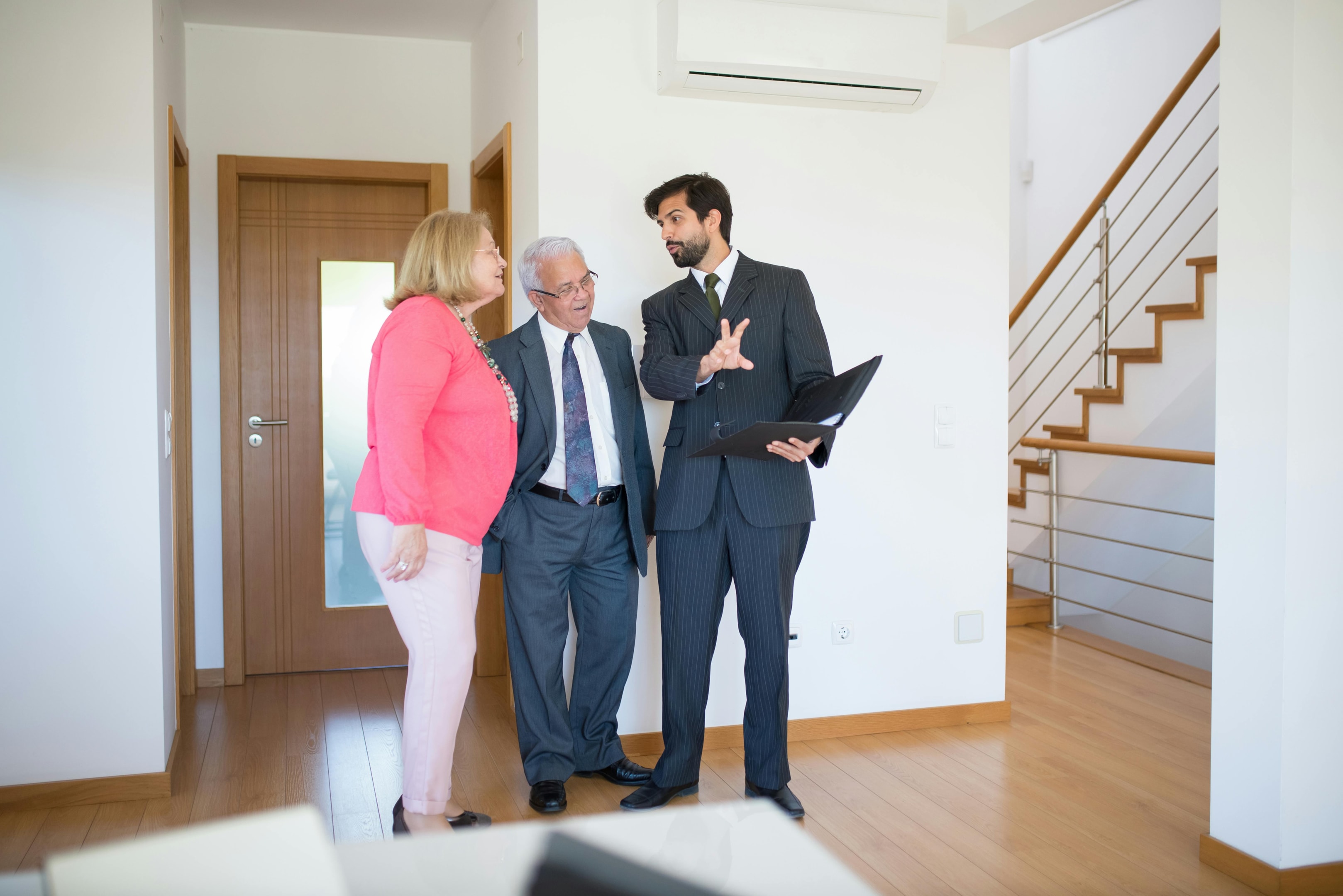 Real estate investor meets with heirs of probate property as they review the property.