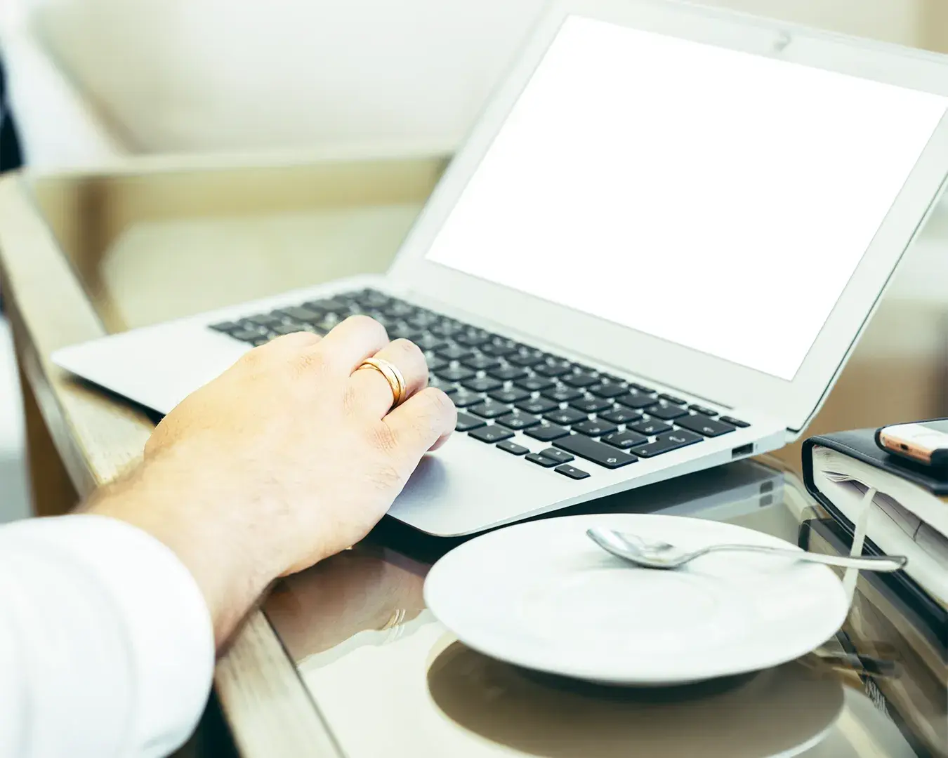 Restaurant owner managing Google Business Profile and local SEO on a laptop inside a café, highlighting digital marketing, local search optimization, and restaurant online visibility.