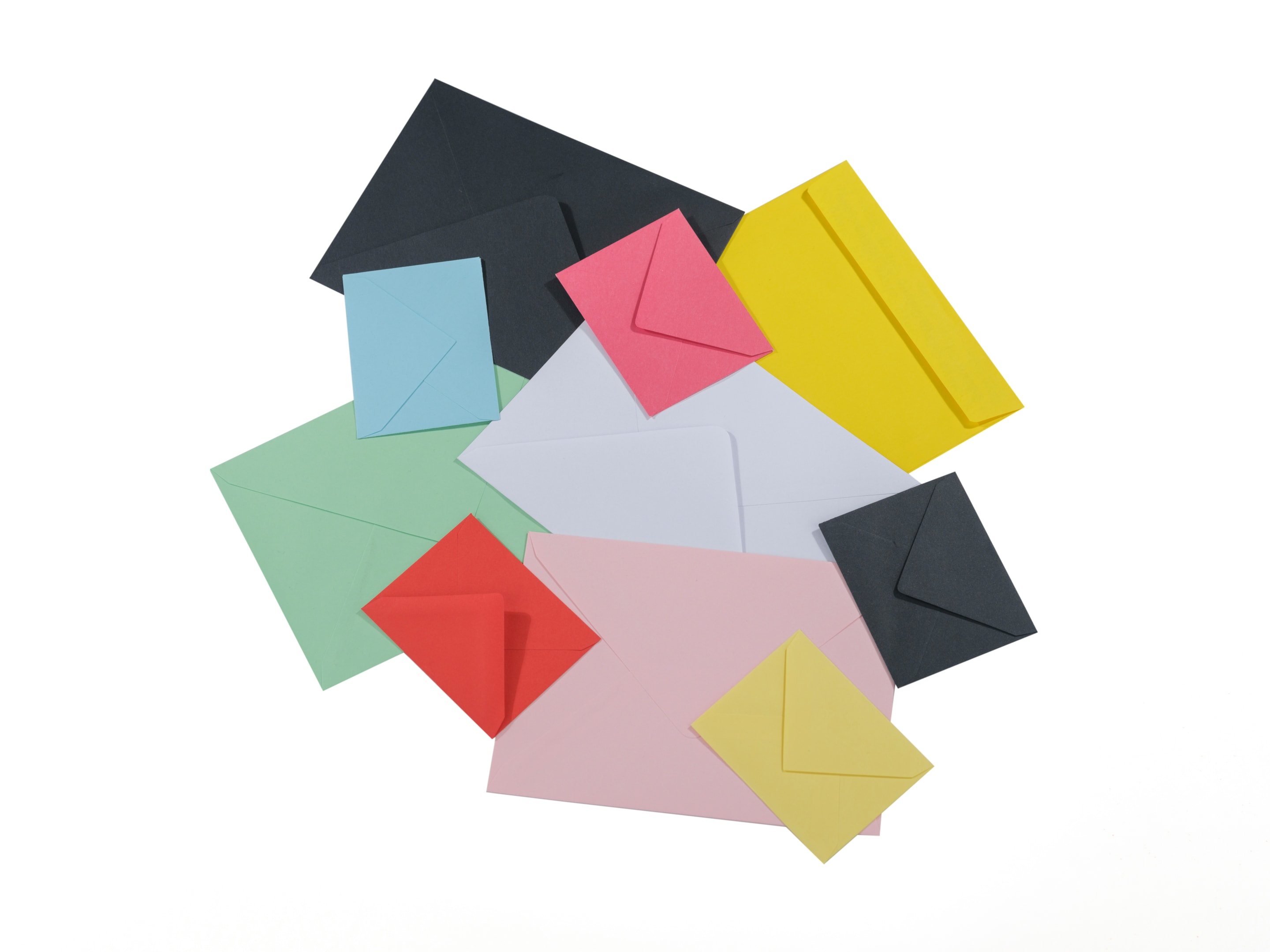 Groups of envelopes in different colors and sizes used by realtor.