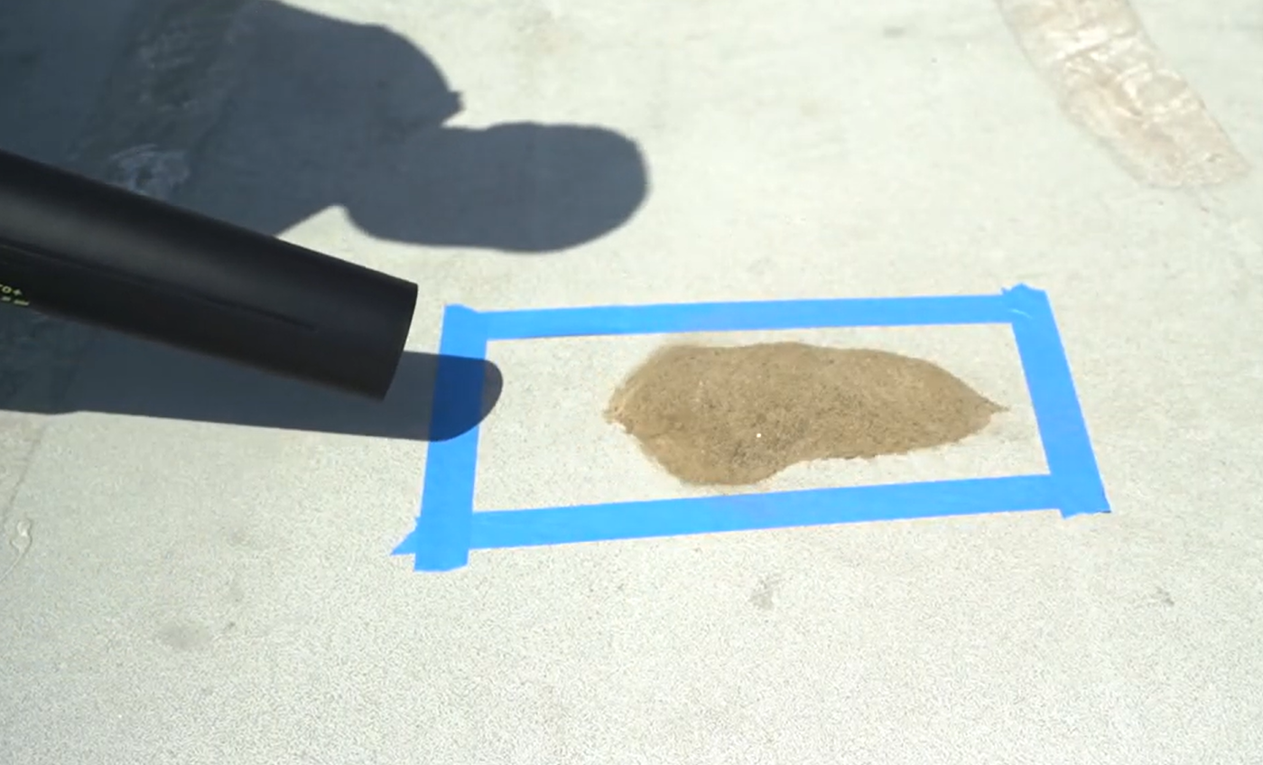 clearing sand using the YOOVL cordless leaf blower