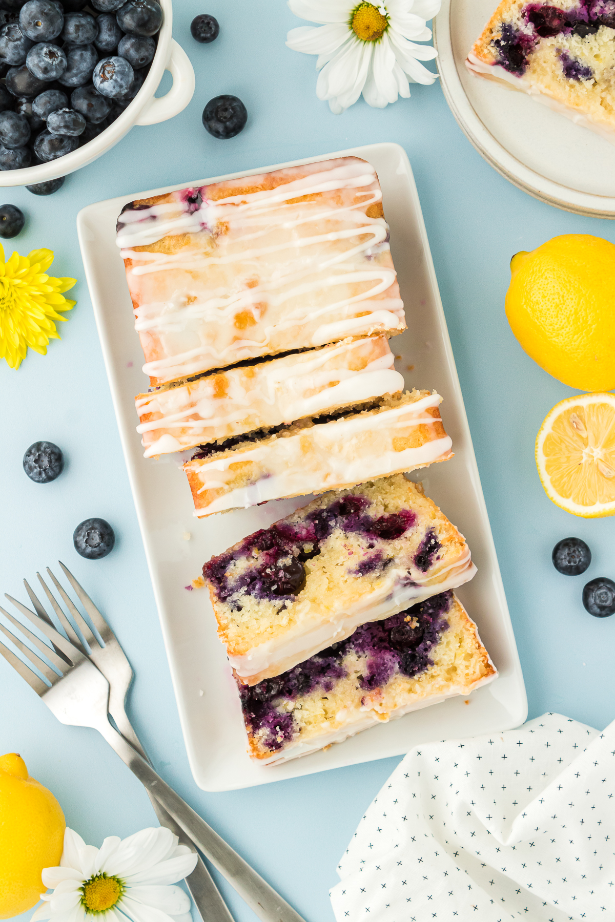 sliced lemon blueberry bread on a plate