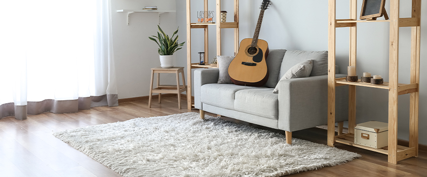 The front legs only layout, where you only place the front legs of your furniture on the rug, is perfect for small living rooms.