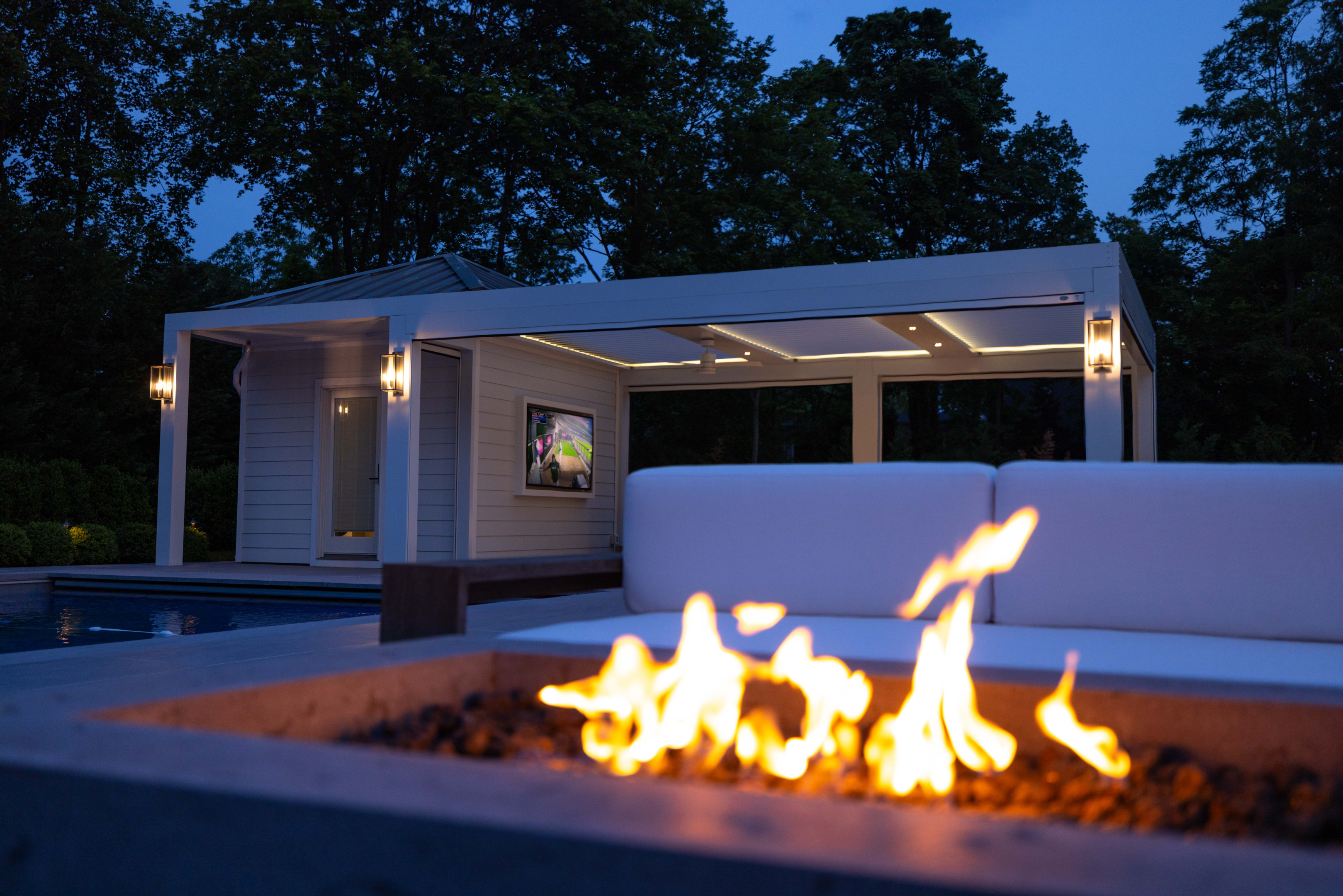 focus night image of fire place near outdoor Pergola