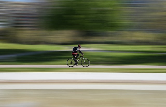 A cyclist on a bike.