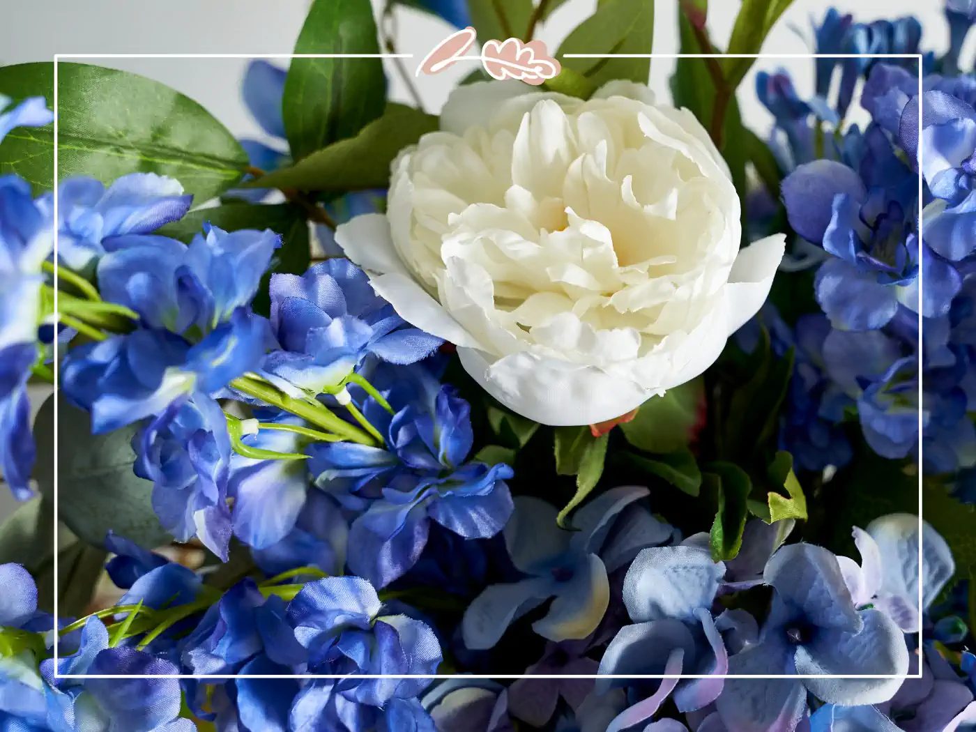 Close-up of artificial blue and white flowers, showcasing realistic textures and beauty - Fabulous Flowers and Gifts.