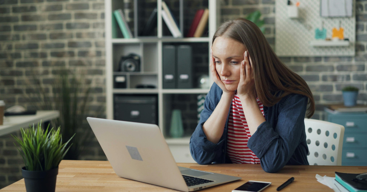 Woman reviewing Form 1120-F instructions on her computer to stay compliant with tax laws.