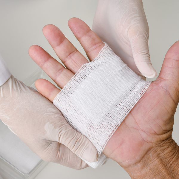 A photo showing a hand being wrapped carefully to accelerate wound healing