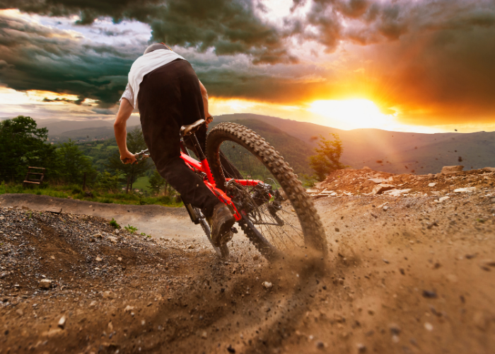 A mountain biker riding a mountain bike on a trail