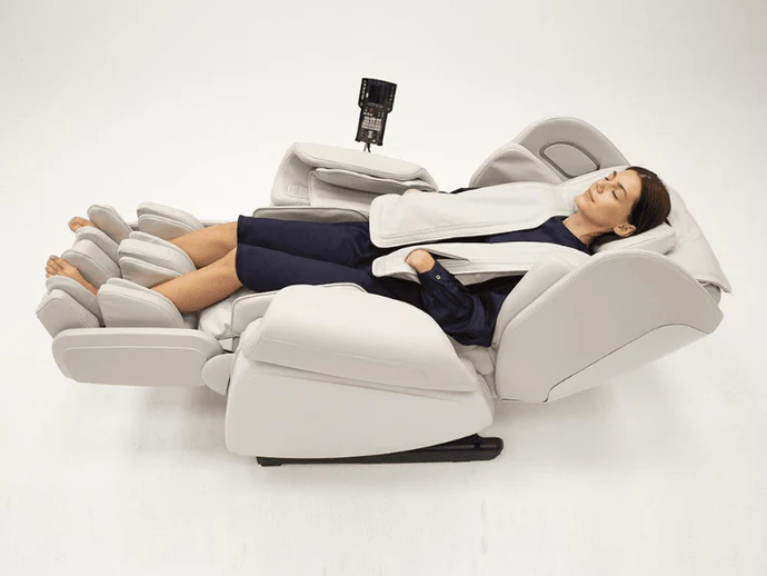 Woman on a Zero Gravity Massage Chair, showing Reclining position. 