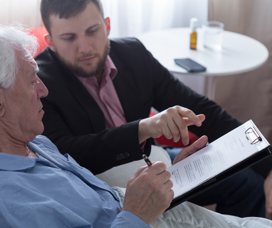 A lawyer talking to a patient in a rehab center about their legal protection