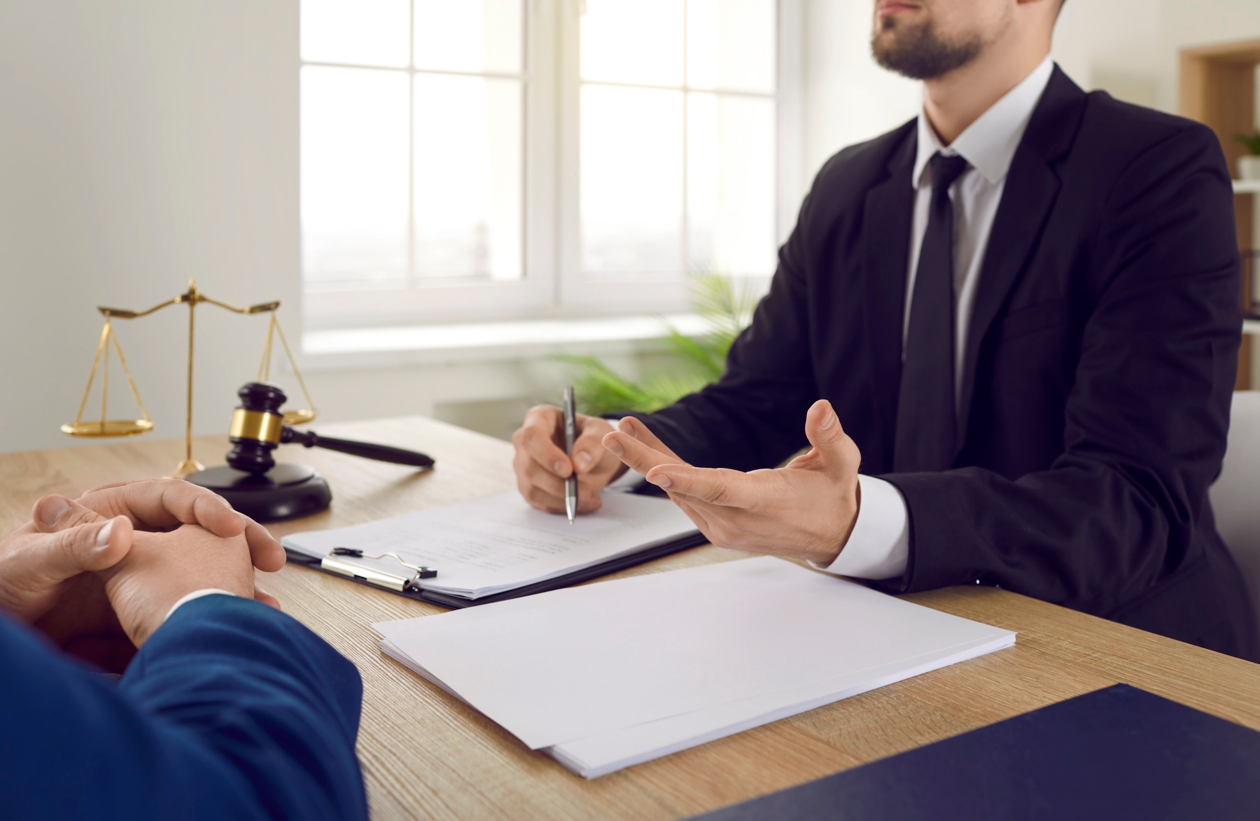 A solicitor talks to a client about how to sue for wrist injury compensation
