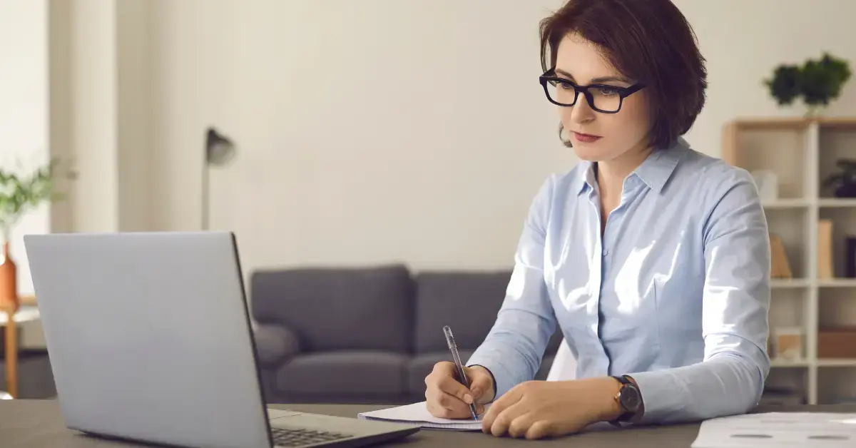 Woman reviewing IRS Notice CP71C and checking her unpaid tax balance and financial records.