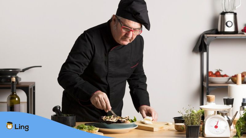 A photo of a Bosnian chef plating food.