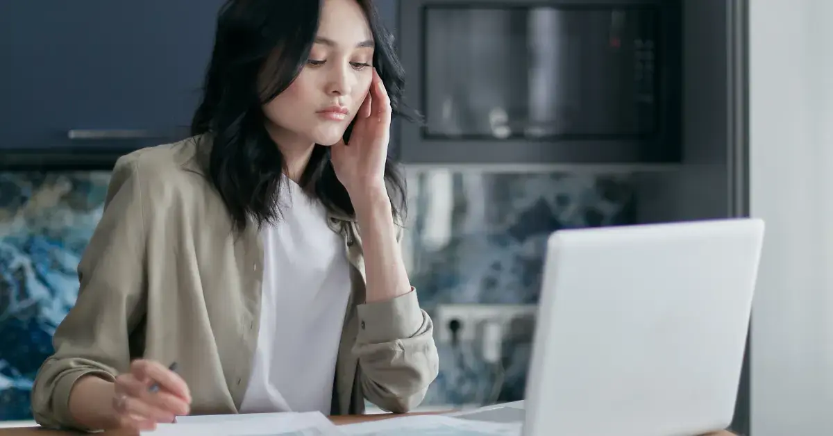 Woman reviewing Form 668-W after receiving an IRS wage levy through her employer.