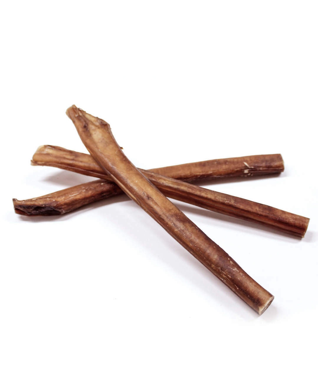The image shows a large, thick monster bully stick placed next to a regular bully stick, illustrating their size comparison. This visual highlights the long-lasting chew options for dogs, especially suitable for heavy chewers and large dogs who love a healthy and natural treat.