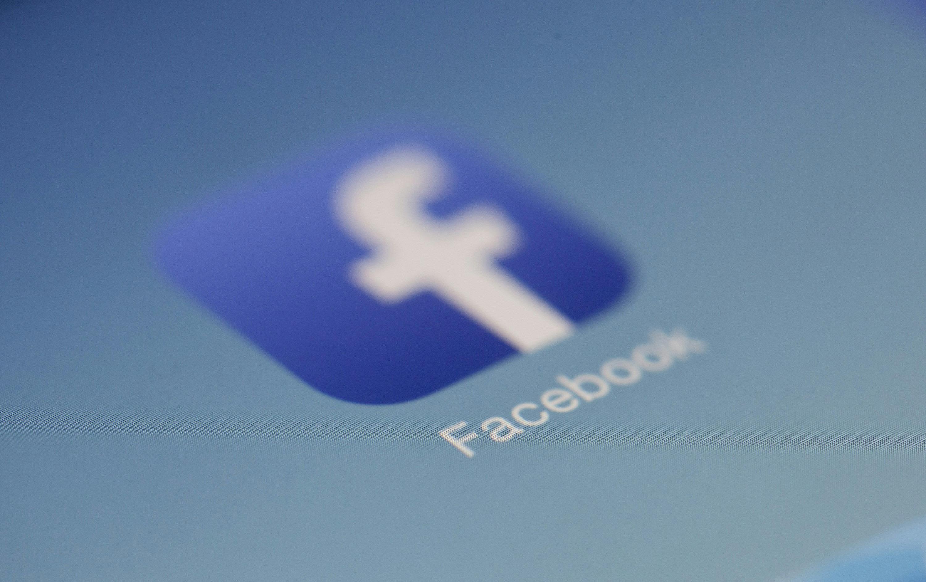 Facebook app logo on phone.