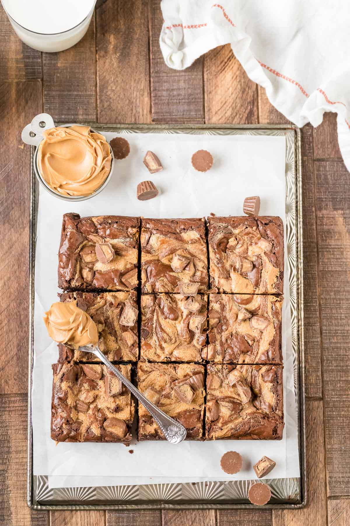 chocolate peanut butter brownies cut into squares on a baking sheet