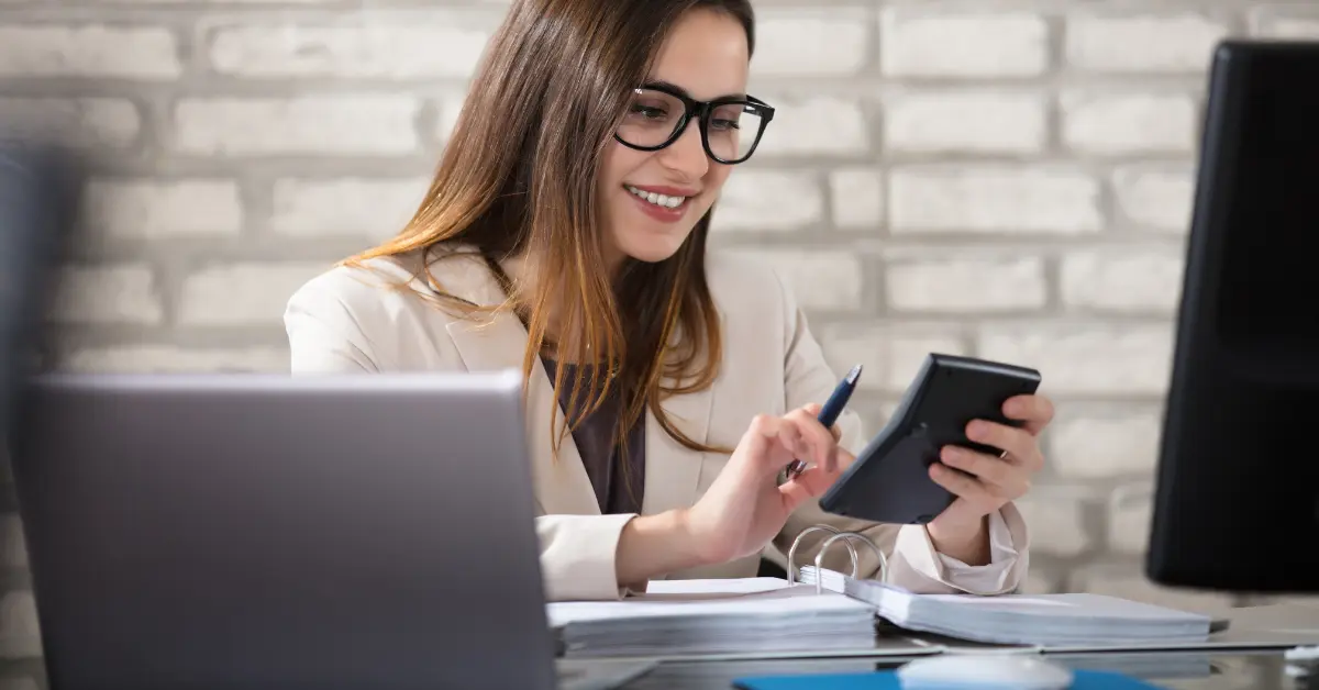 Does a single-member LLC need to file a BOI? Woman preparing her taxes for compliance with the Corporate Transparency Act.