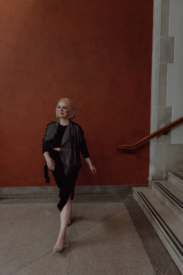 Laura Umansky walks in a hall