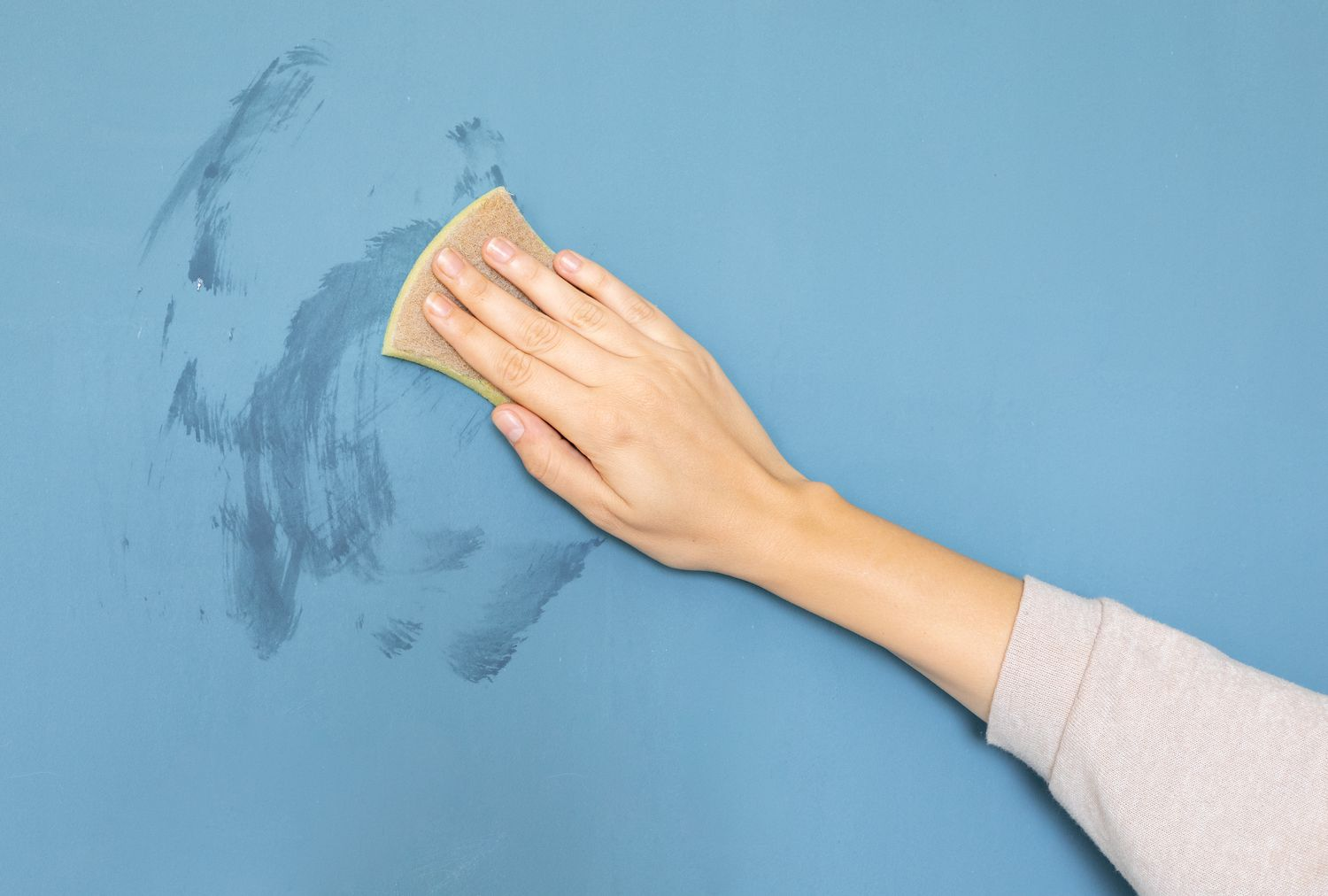 Make a cleaning solution using liquid dish soap and white vinegar with warm water to clean painted walls