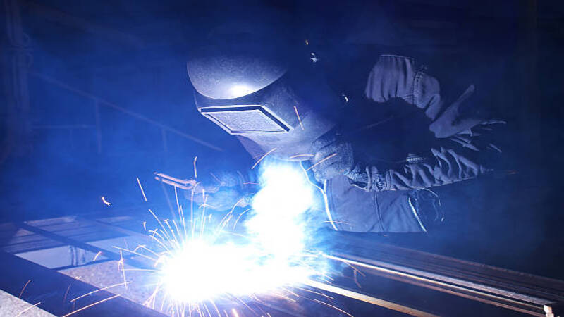 A technichian using plate welding for joining flat surfaces. 