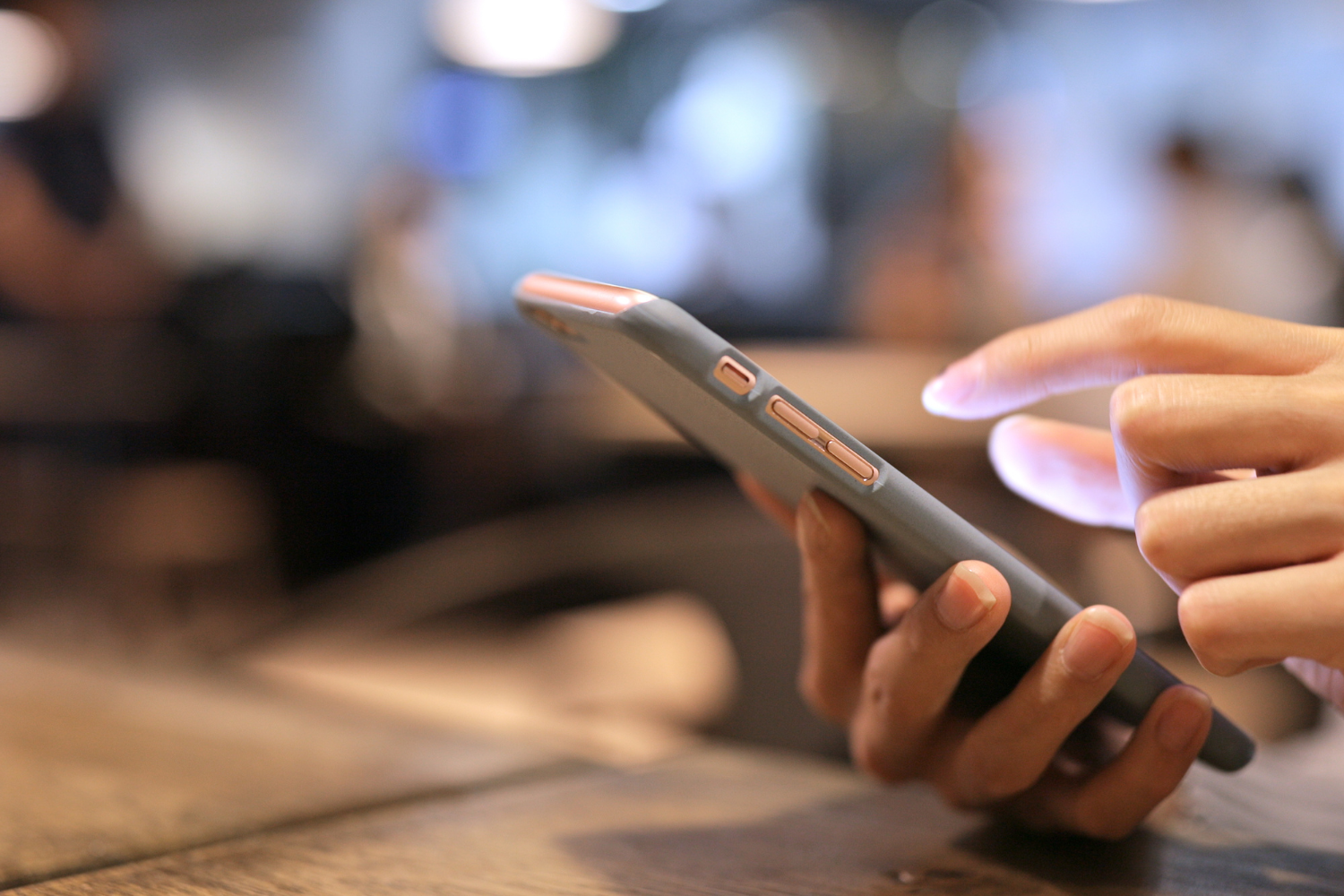 A worker using a phone to submit update.