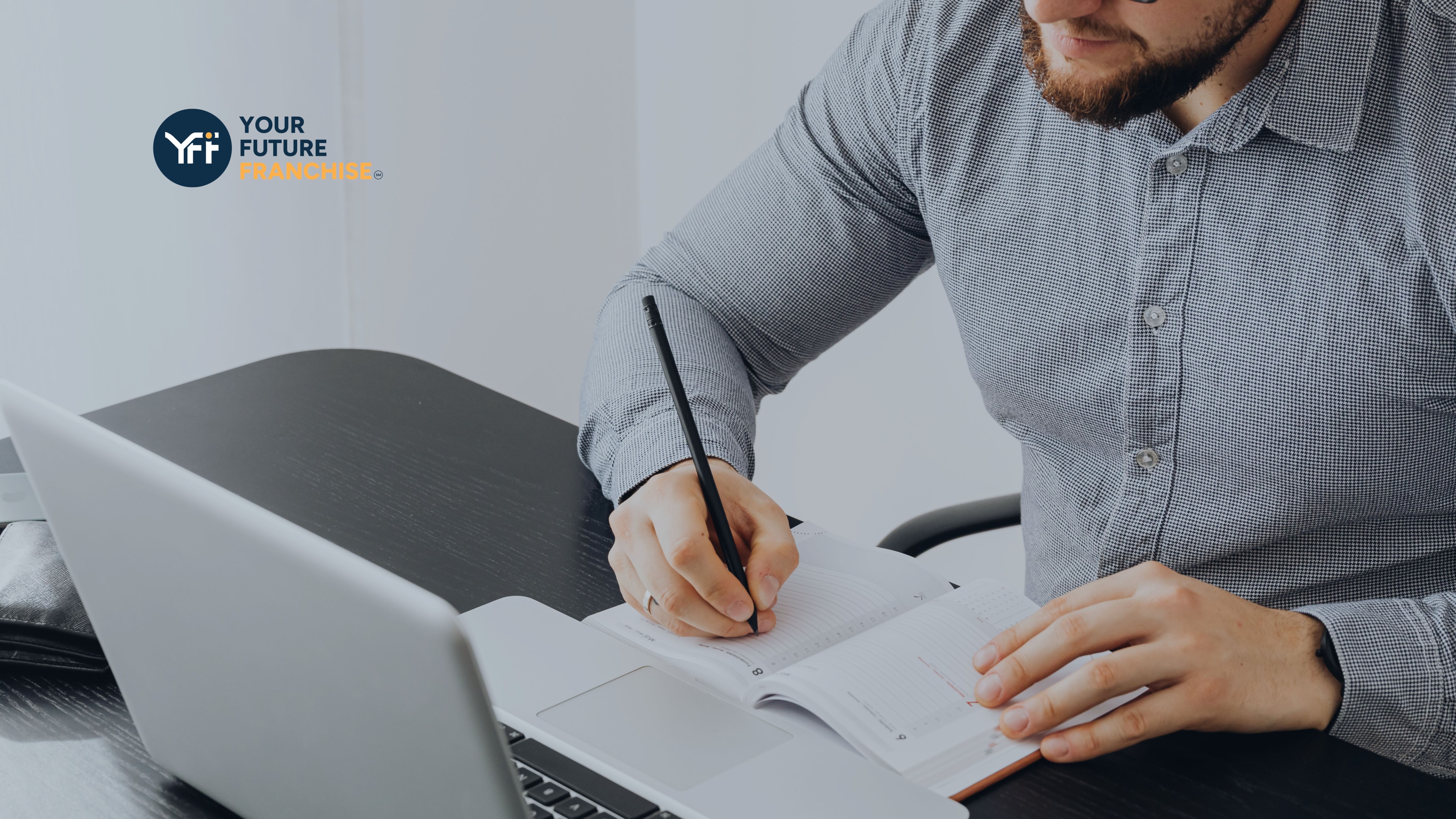 A man evaluating business outcomes on his laptop