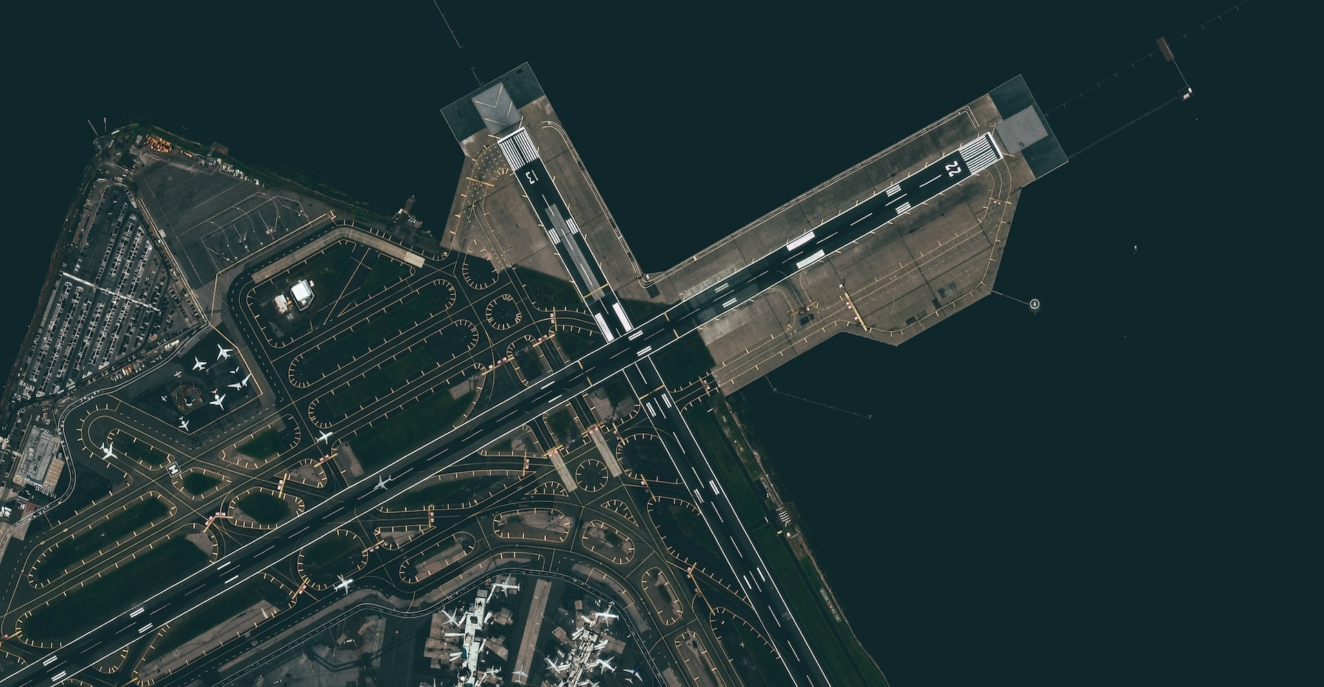 Two intersecting runways at an airport from a satellite.