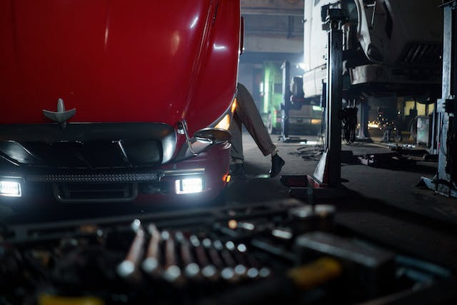 Repair tech servicing a fleet vehicle