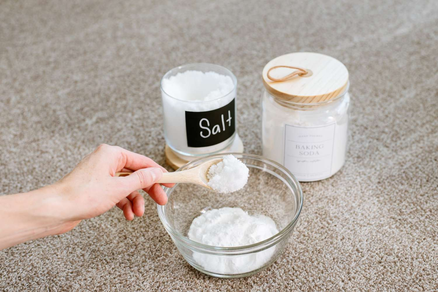 Combine baking soda and salt in a basin to clean your carpet