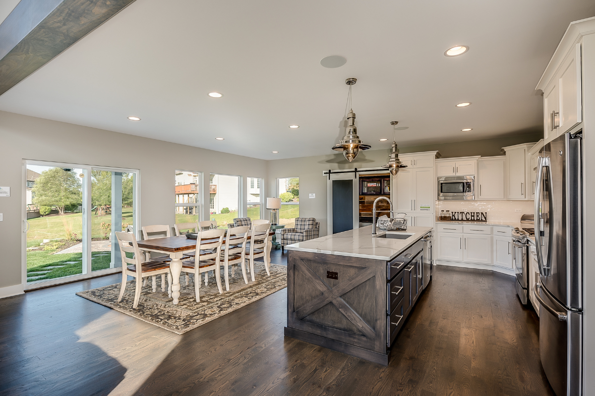 A modern farmhouse kitchen with rustic and contemporary elements.