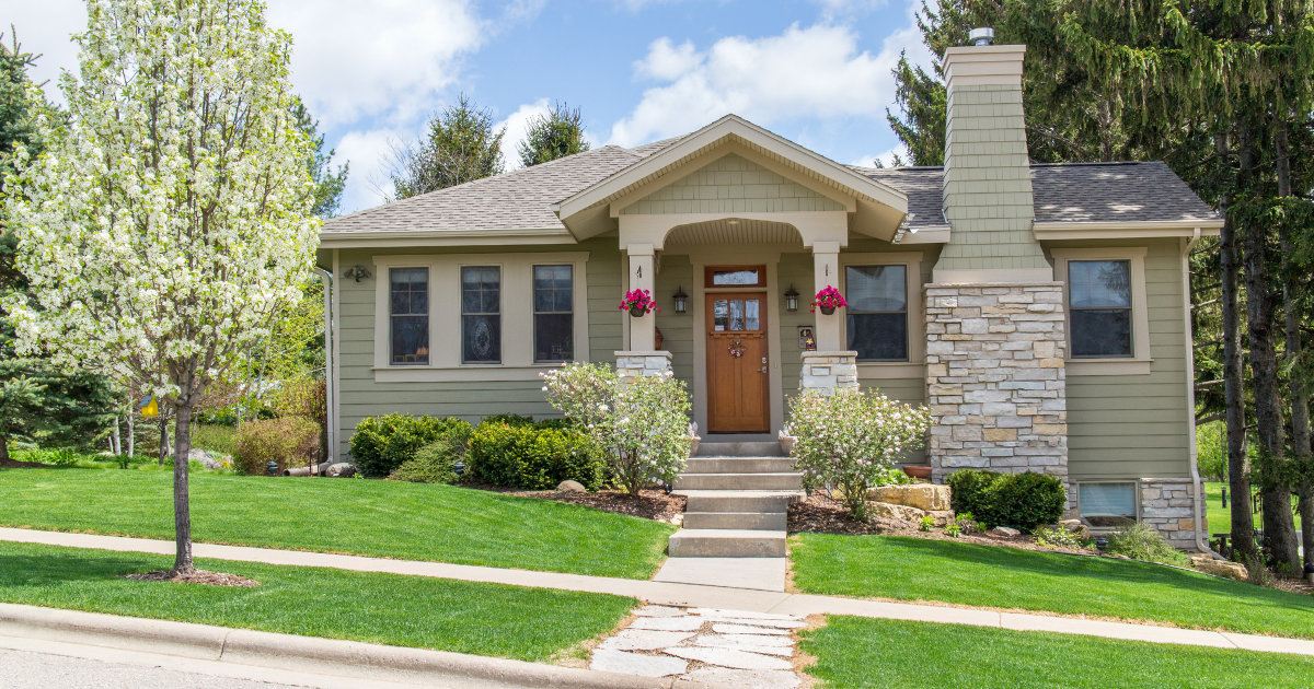 Craftsman-style ranch home with stone chimney and covered front porch, a common home style for first-time buyers in the Augusta, GA area