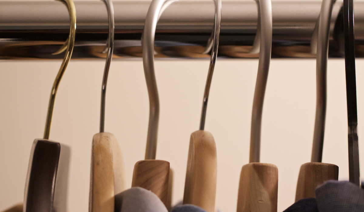 Close-up curtain rail with coat hangers