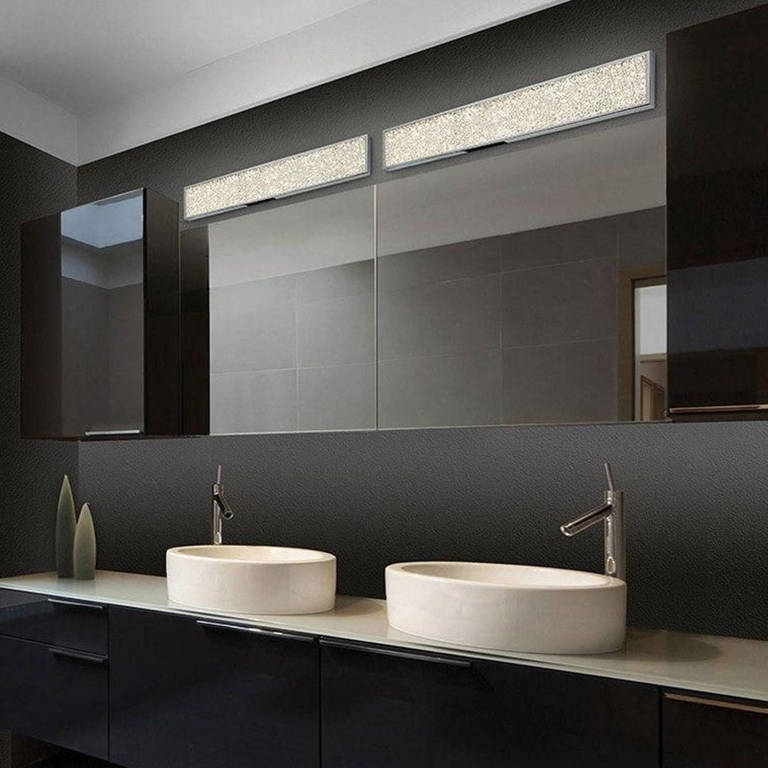 Contemporary bathroom with double mirrors, vessel sinks, and crystal-accented bathroom light fixtures, offering elegant and modern bathroom lighting ideas.