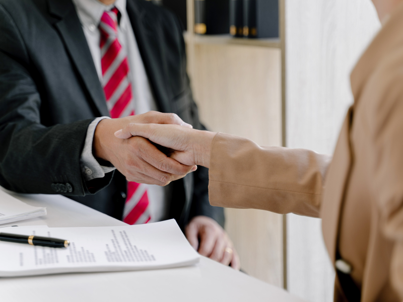An image showing a person consulting with a lawyer about the statute of limitations on truck accidents.