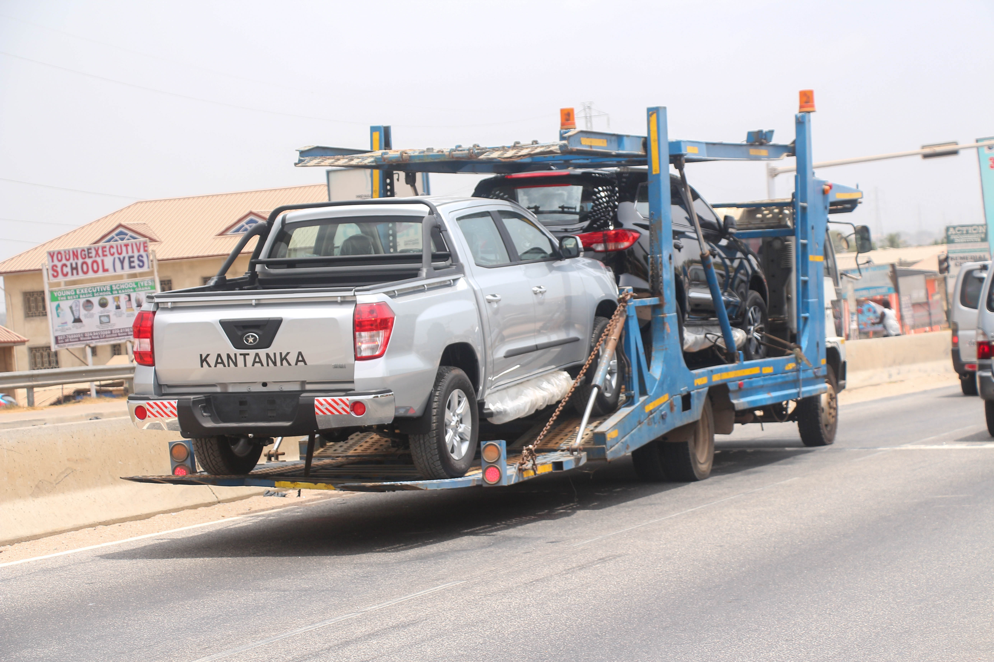 A car being towed away for cash in South Jamaica as part of the cash for cars in South Jamaica program.