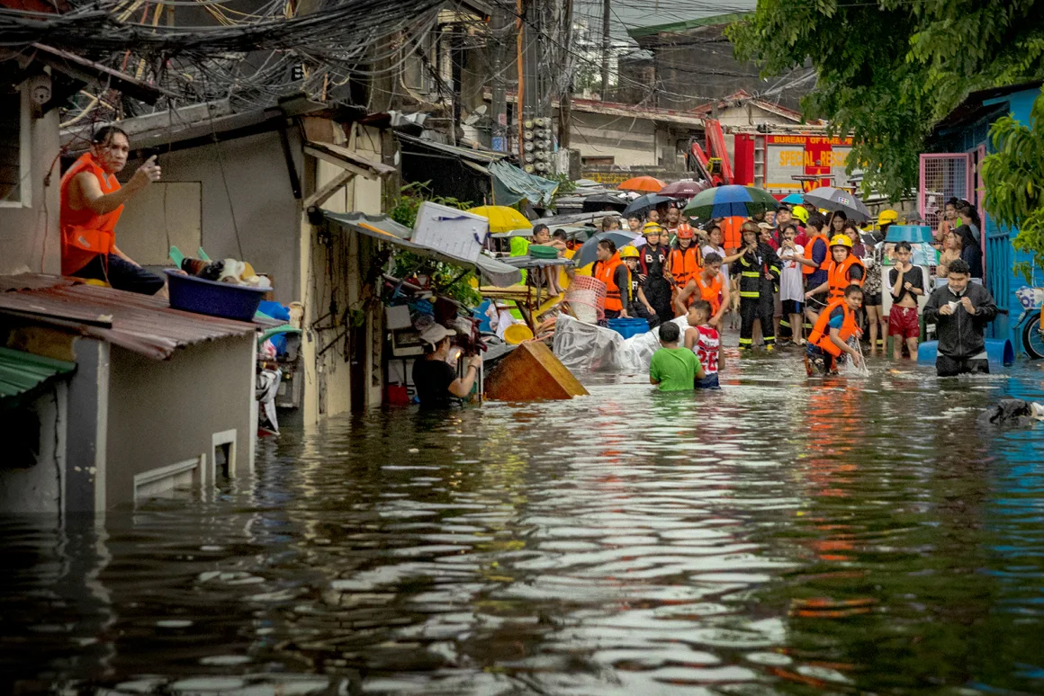 A road is seen flooded caused by Typhoon Gaemi and monsoon rains on July 24, 2024 in Quezon City. Ezra Acayan