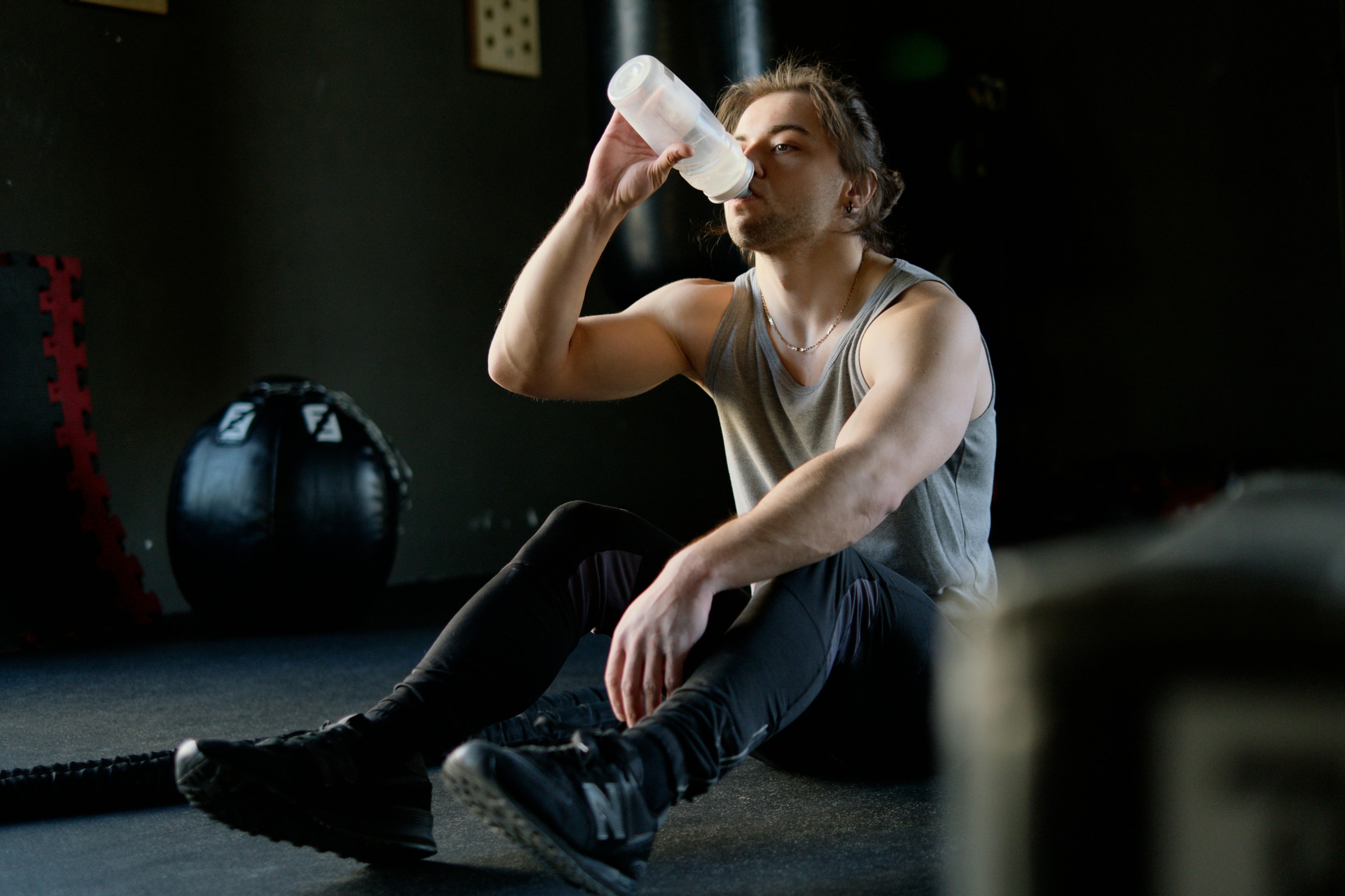 Photo by Ivan Samkov: https://www.pexels.com/photo/man-sitting-on-the-floor-and-drinking-water-4164764/