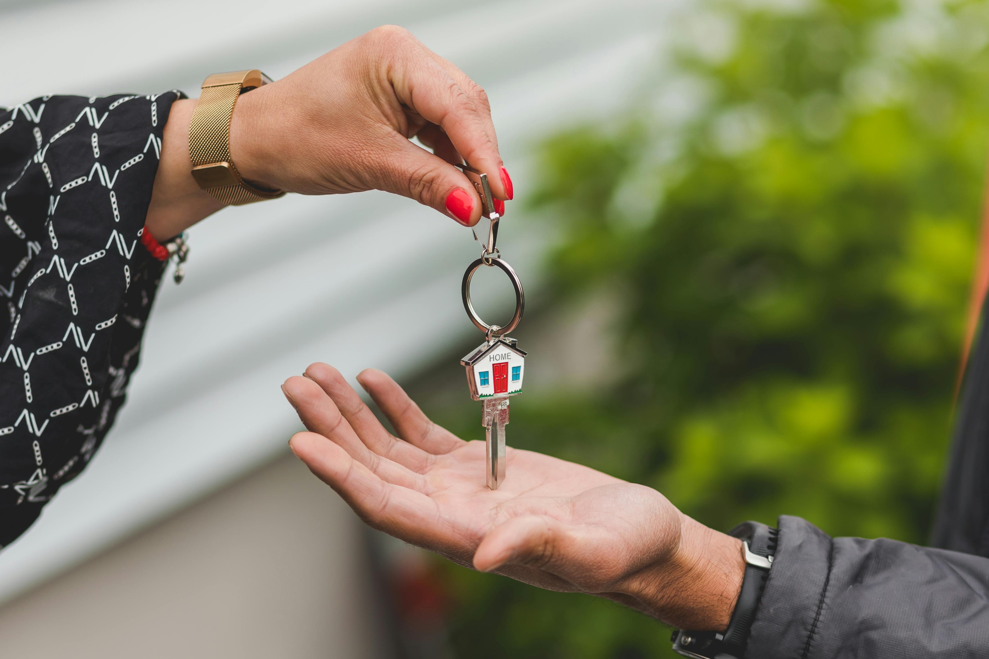 Property manager hands off key to new tenant.
