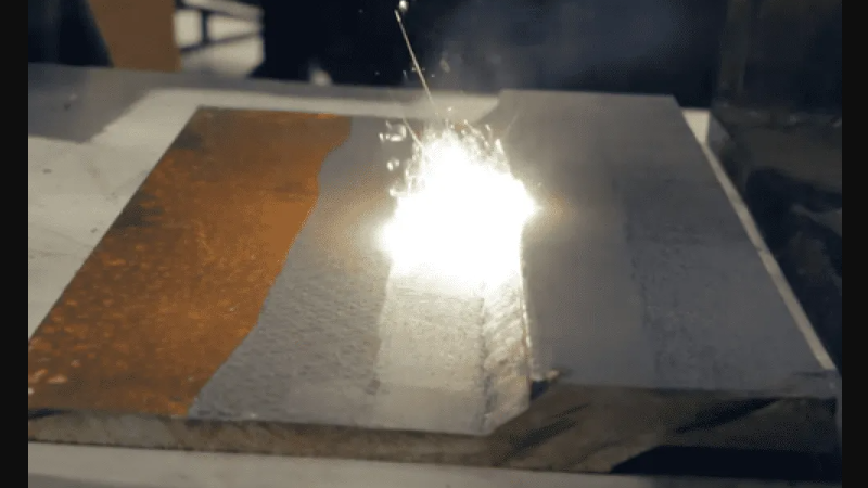 Removing rust from steel with a 2000-watt laser.
