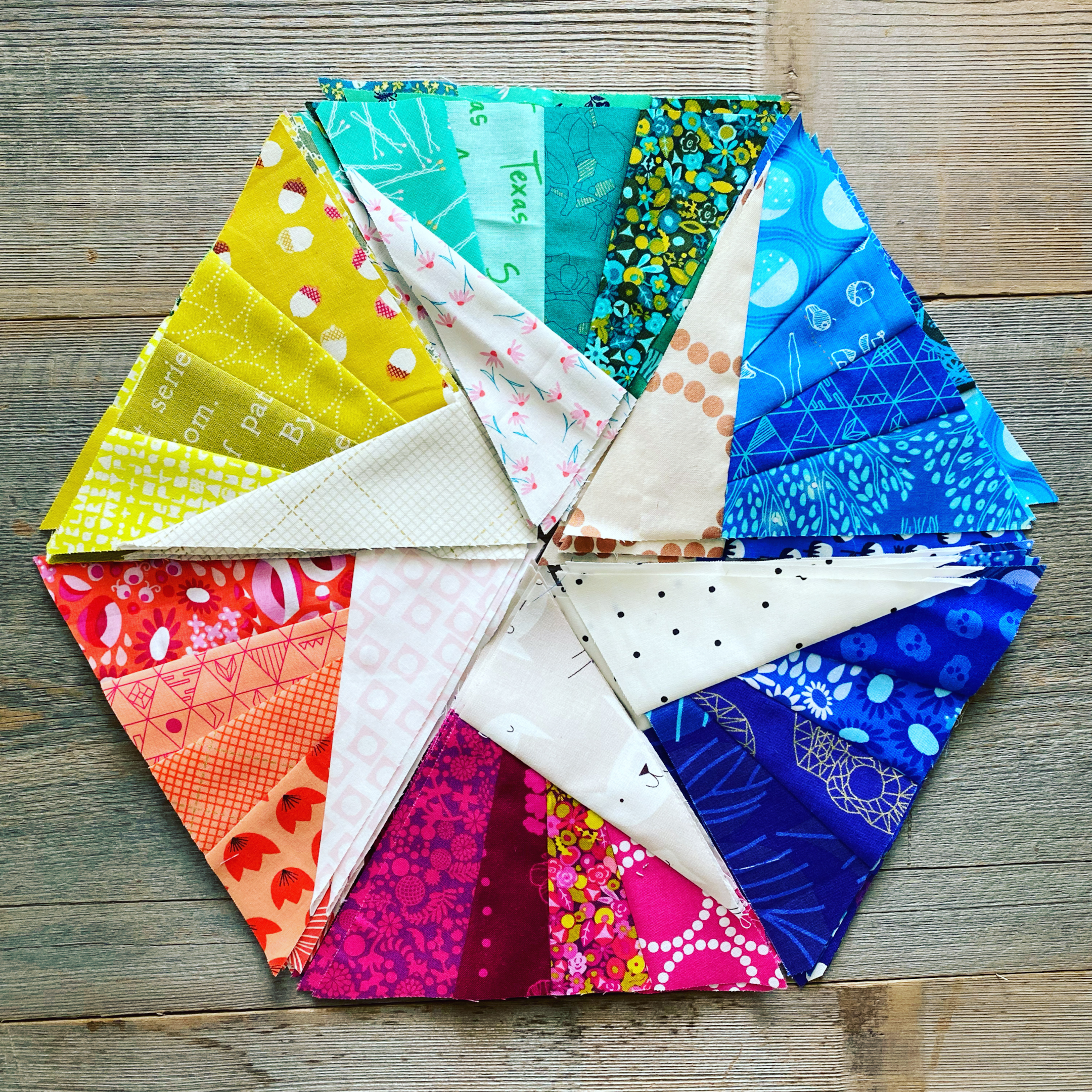Image shows the Scrappy Whirligig, one of our free quilt patterns