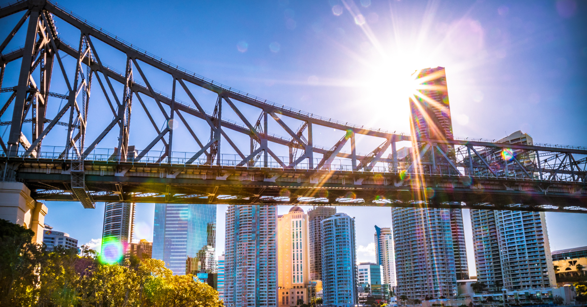 Rentvesting - Bridge infront of large commercial properties in Australia