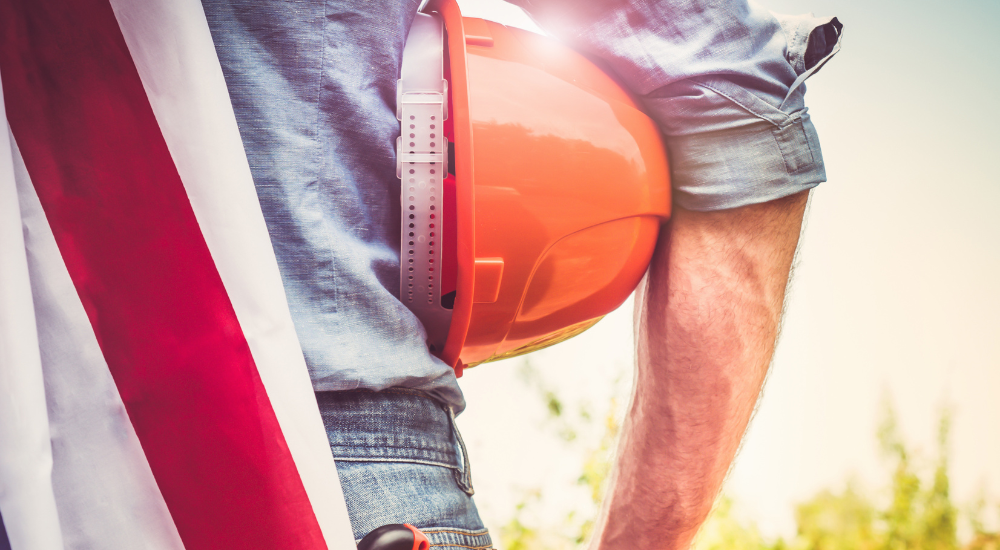 Construction helmet in hand